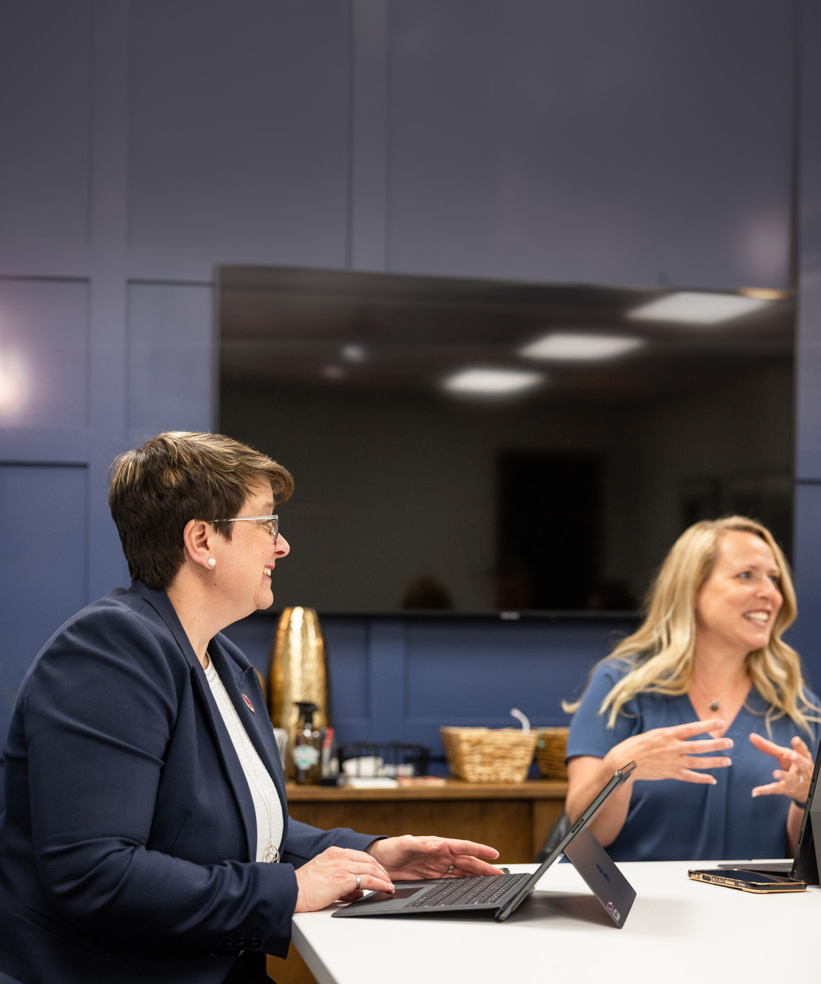 Blue Room Meeting Two Women