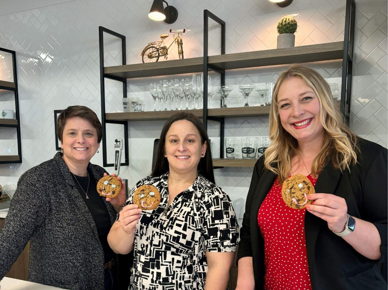 Employees Holding Smile Cookie - CSR